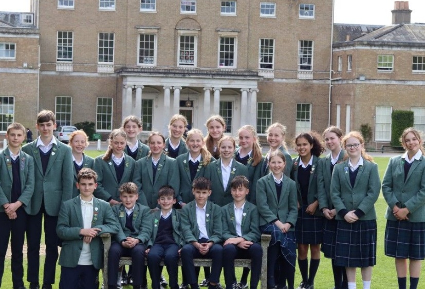 scholarship and award winners from Heath Mount's Class of 24 pose in the sunshine in front of the Grade I listed mansion house